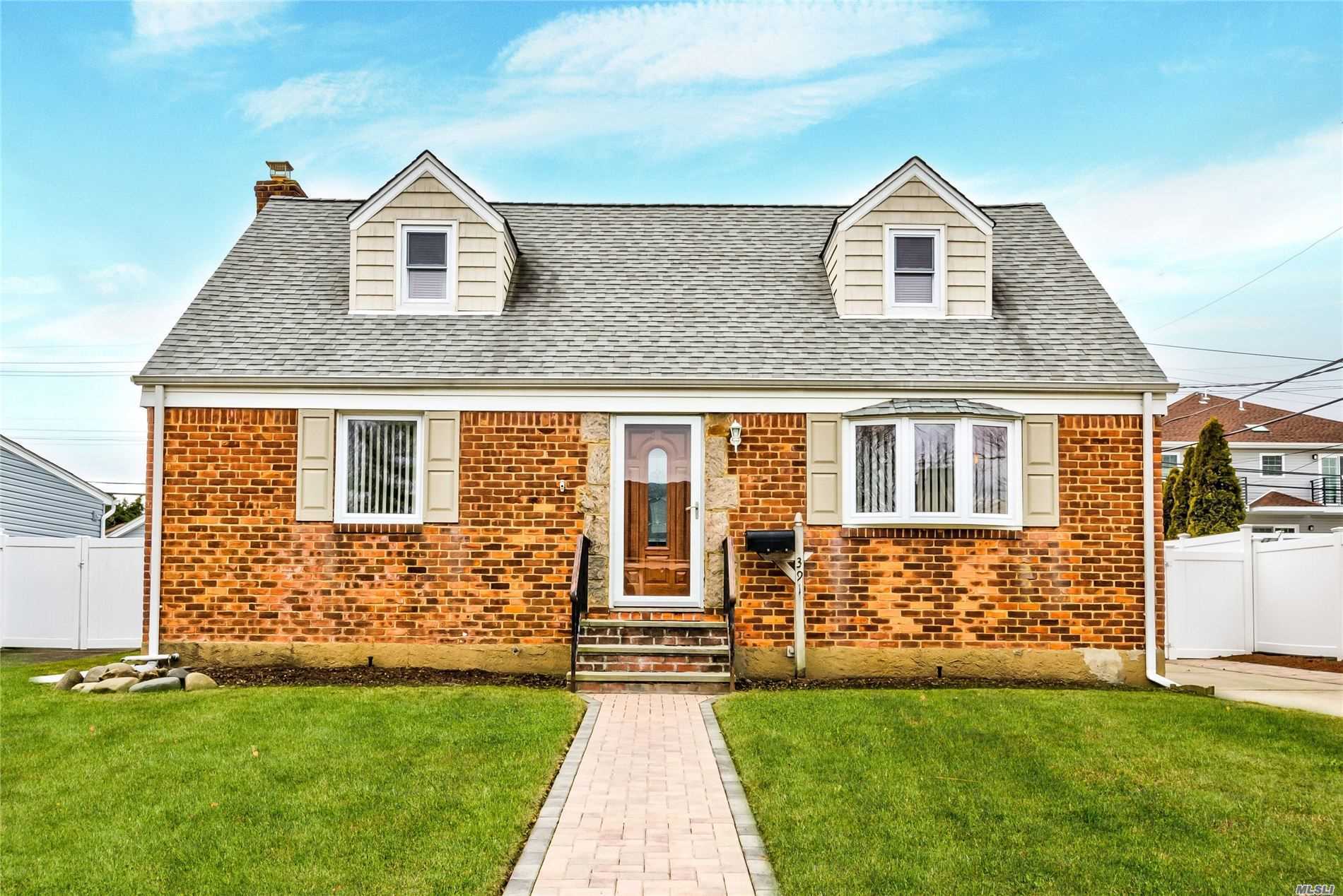391 Salem Road Valley Stream, NY 11580 - Photo 1 of 1 a front view of a house with a yard