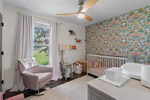 a bedroom with furniture and a window