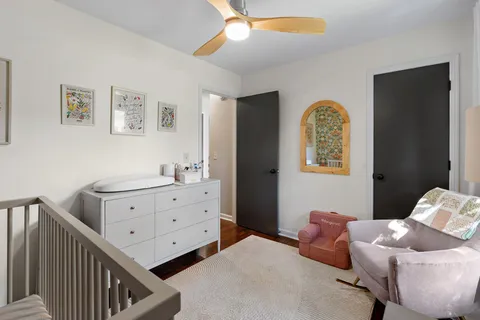 a bedroom with furniture and a window