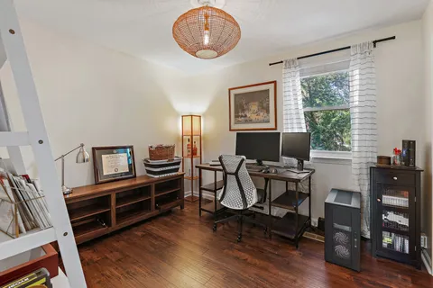 a view of a livingroom with furniture and a window