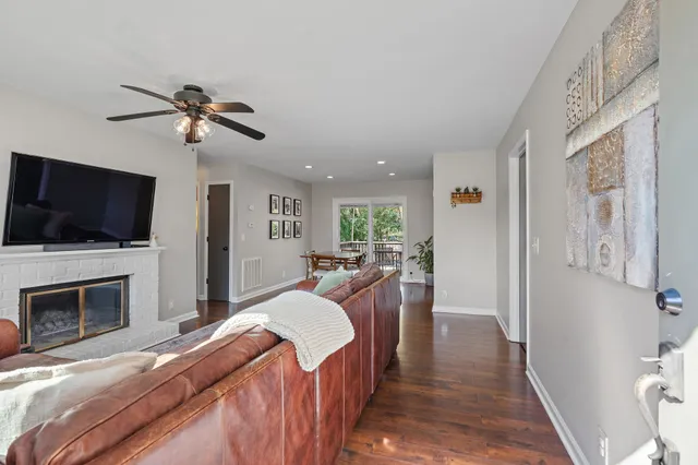 a view of a livingroom with furniture and a flat screen tv