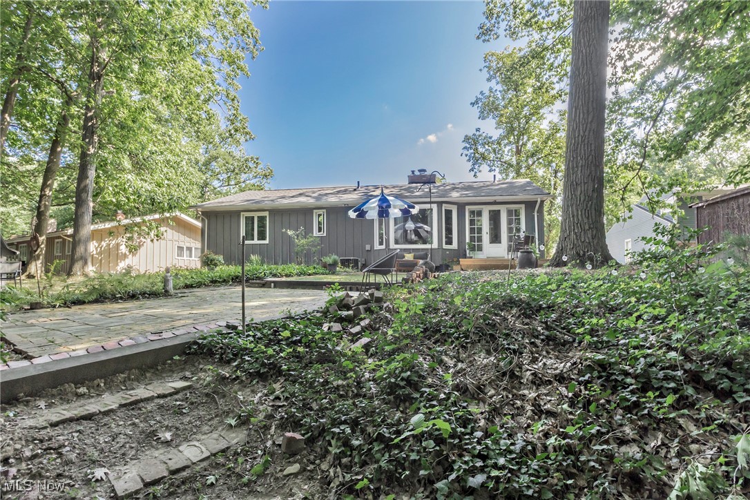 3568 Atherstone Road Cleveland, OH 44121 - Photo 47 of 50 Ranch-style home featuring a wooden deck, custom landscaping, patio areas and a NEW ROOF!