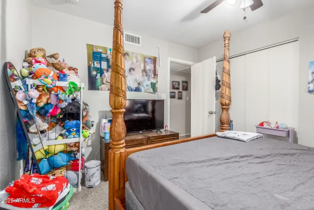 a bedroom with a bed and a window