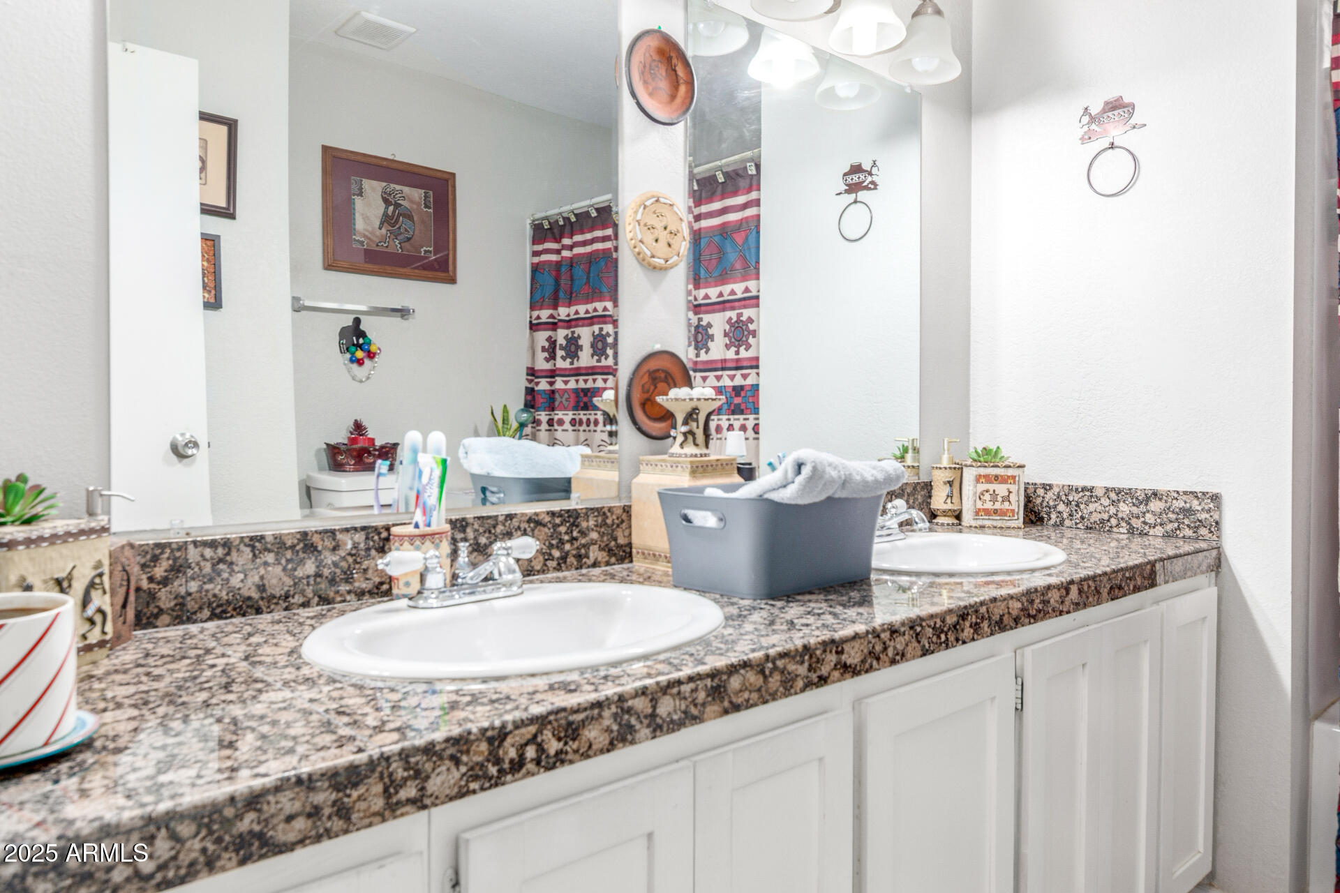 3654 West Shangri-la Road Phoenix, AZ 85029 - Photo 17 of 34 a bathroom with a granite countertop sink and a mirror