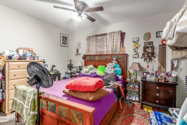 a bedroom with bed and a window