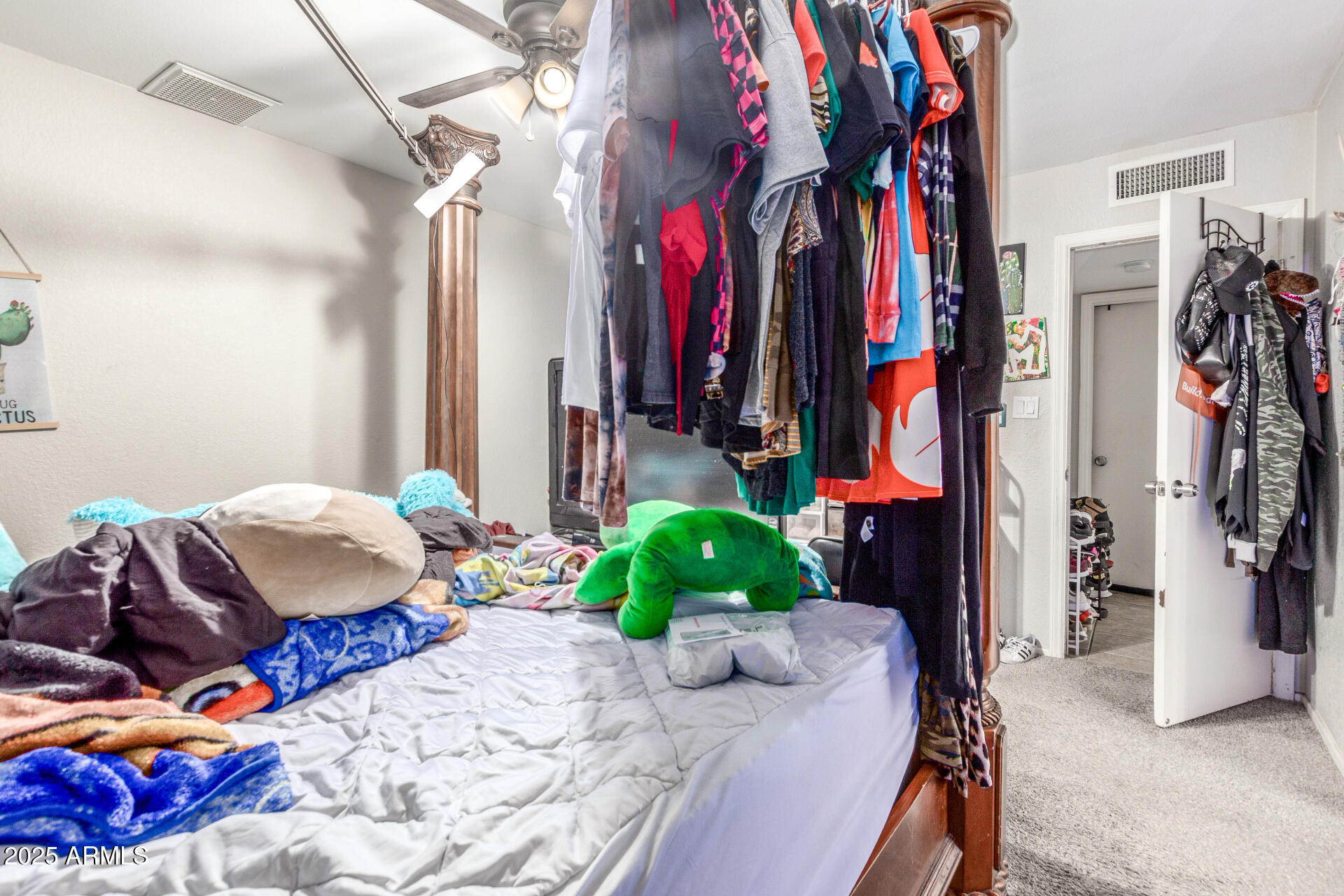 3654 West Shangri-la Road Phoenix, AZ 85029 - Photo 22 of 34 a bedroom with a bed and a view of walk in closet