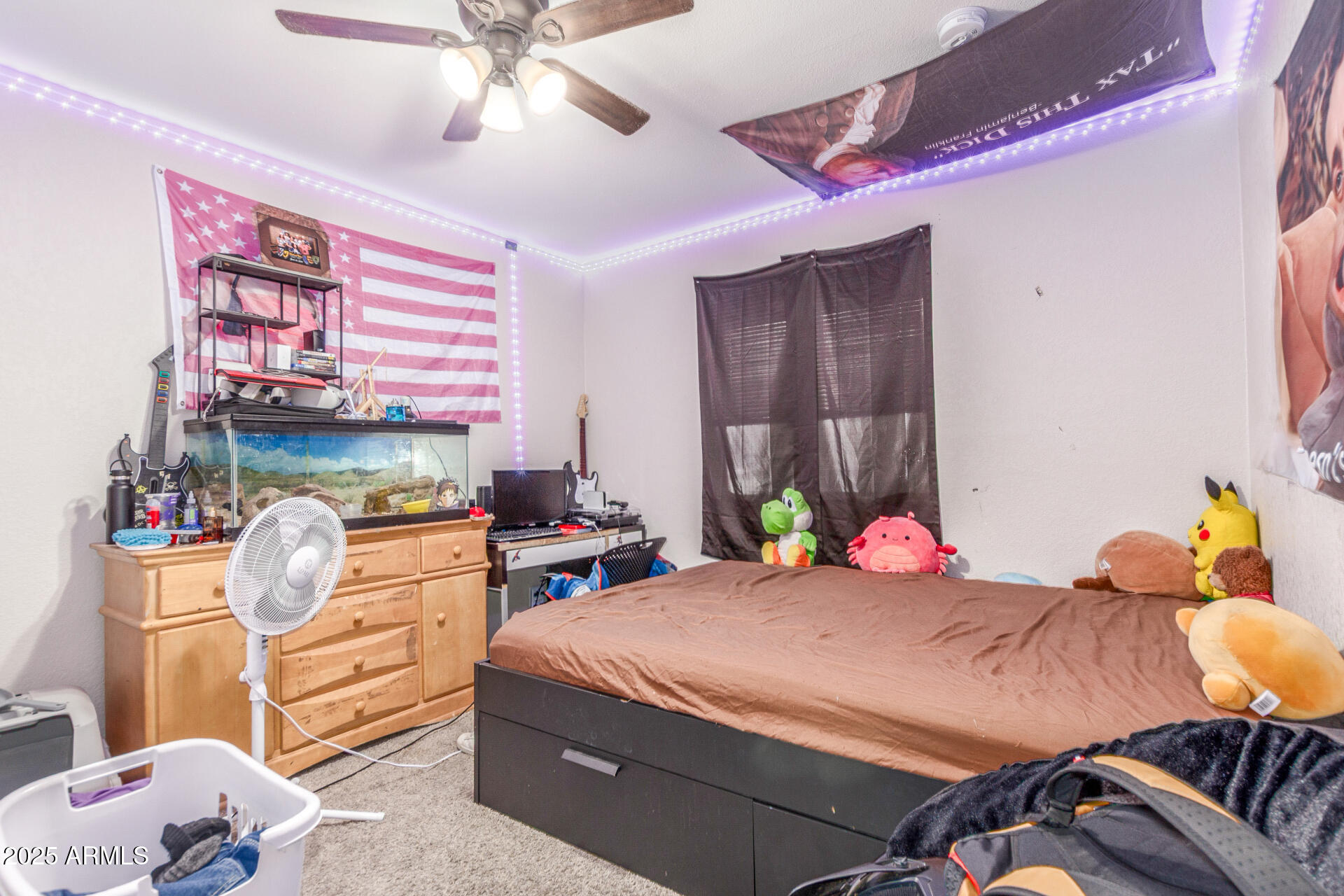 3654 West Shangri-la Road Phoenix, AZ 85029 - Photo 24 of 34 a bedroom with a bed and a chandelier