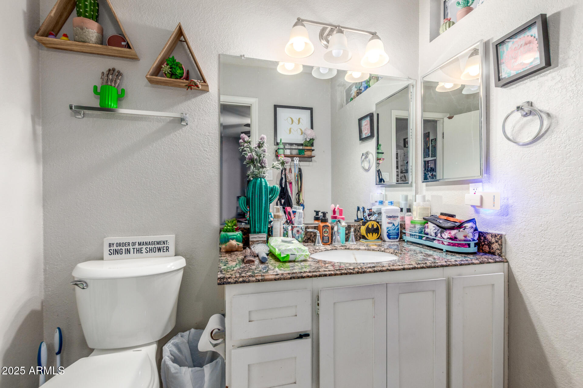 3654 West Shangri-la Road Phoenix, AZ 85029 - Photo 26 of 34 a bathroom with a granite countertop sink a toilet and a mirror