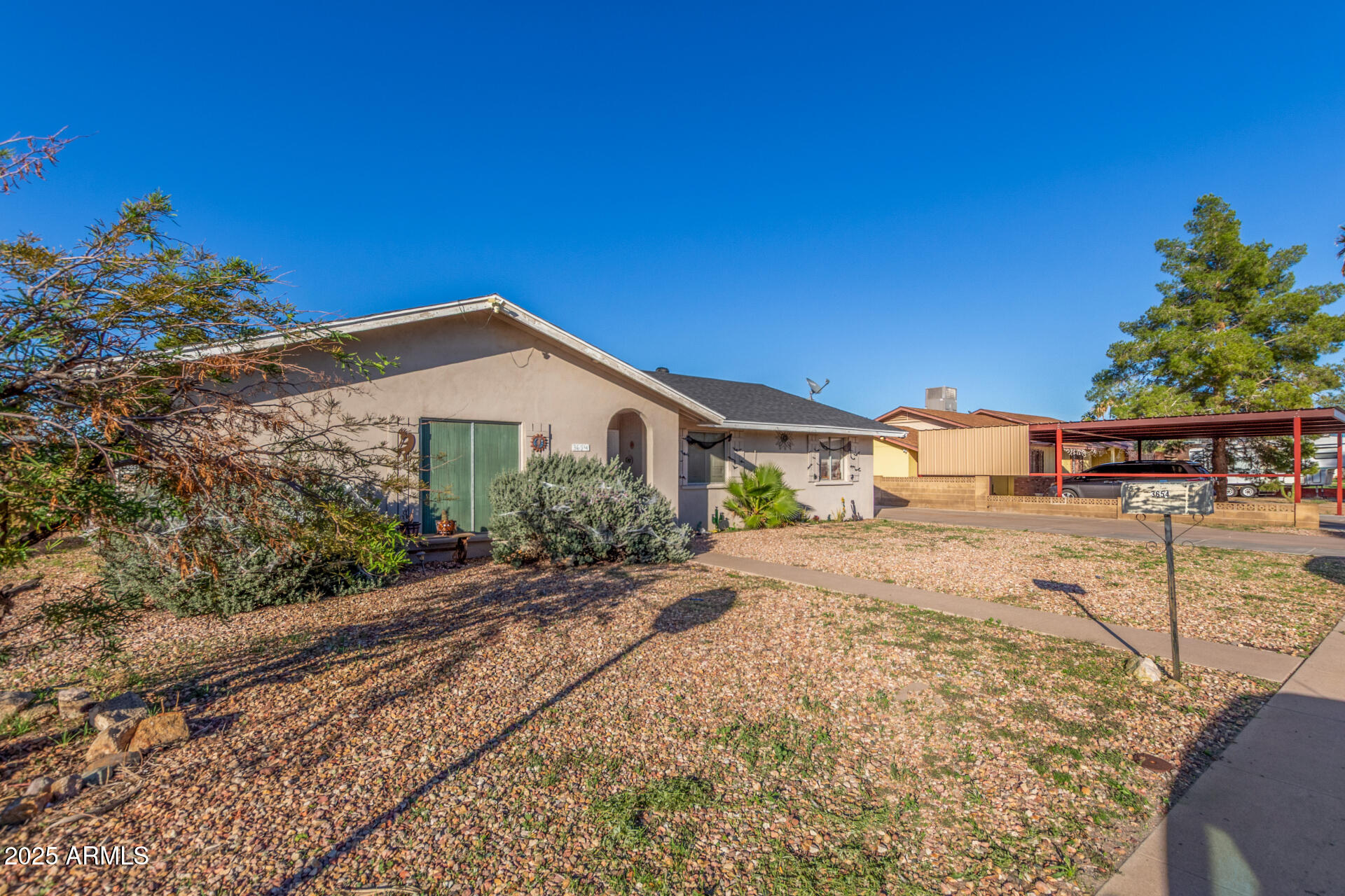 3654 West Shangri-la Road Phoenix, AZ 85029 - Photo 3 of 34 a view of a house with wooden fence