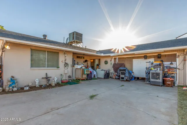a view of a garage with a bike and white car