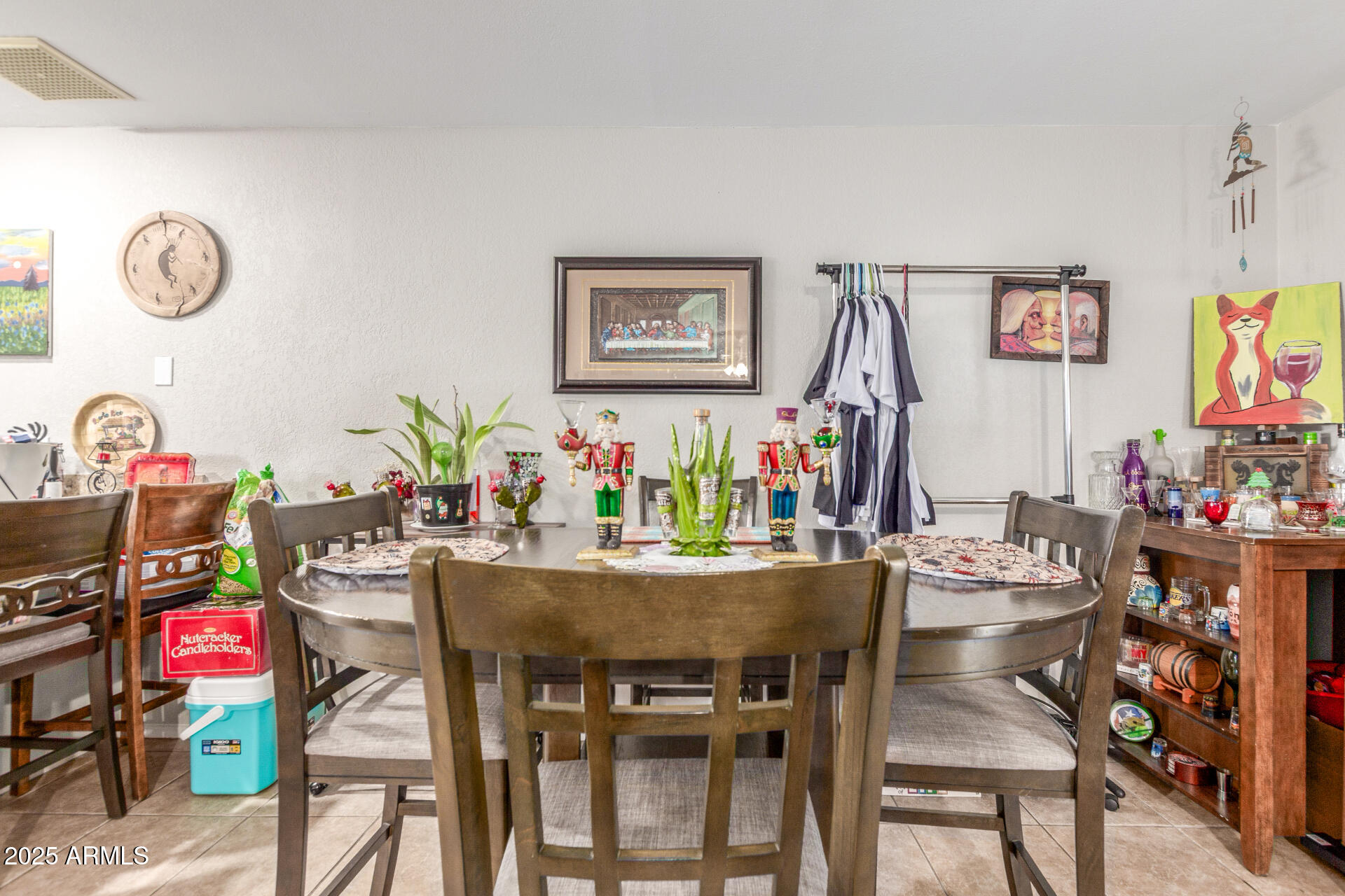3654 West Shangri-la Road Phoenix, AZ 85029 - Photo 10 of 34 a view of a dining room with furniture and a potted plant