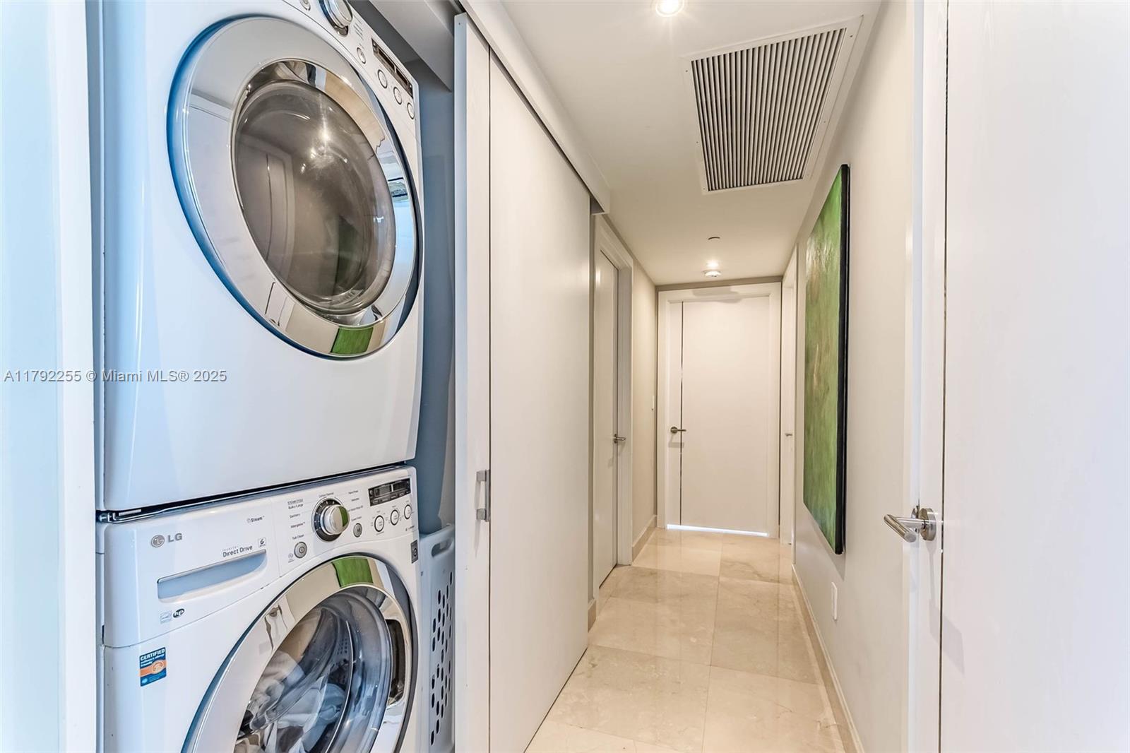 495 Brickell Avenue, Unit 2801 Miami, FL 33131 - Photo 20 of 22 a view of a hallway with washer and dryer