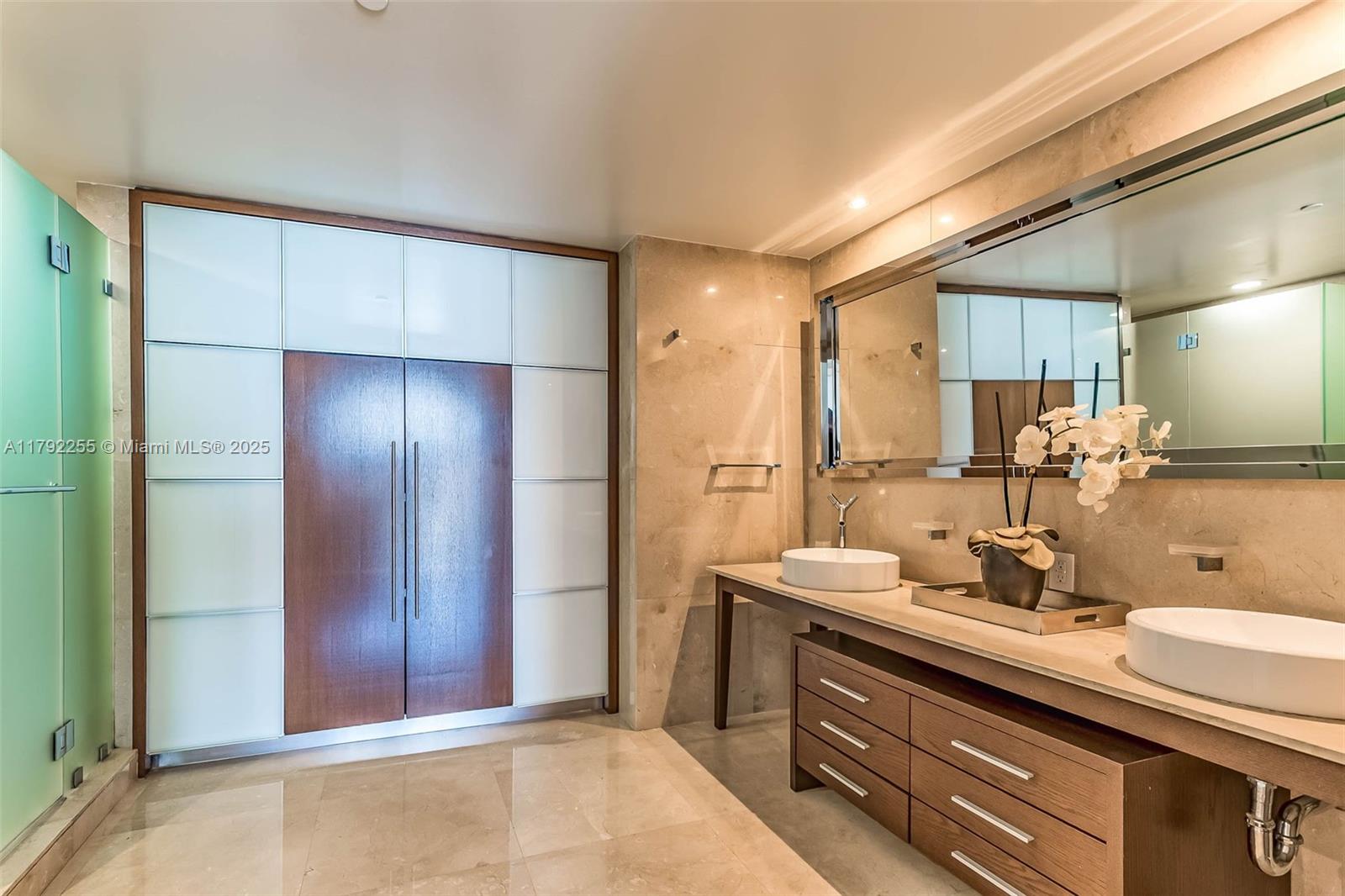 495 Brickell Avenue, Unit 2801 Miami, FL 33131 - Photo 10 of 22 a bathroom with a sink and a mirror
