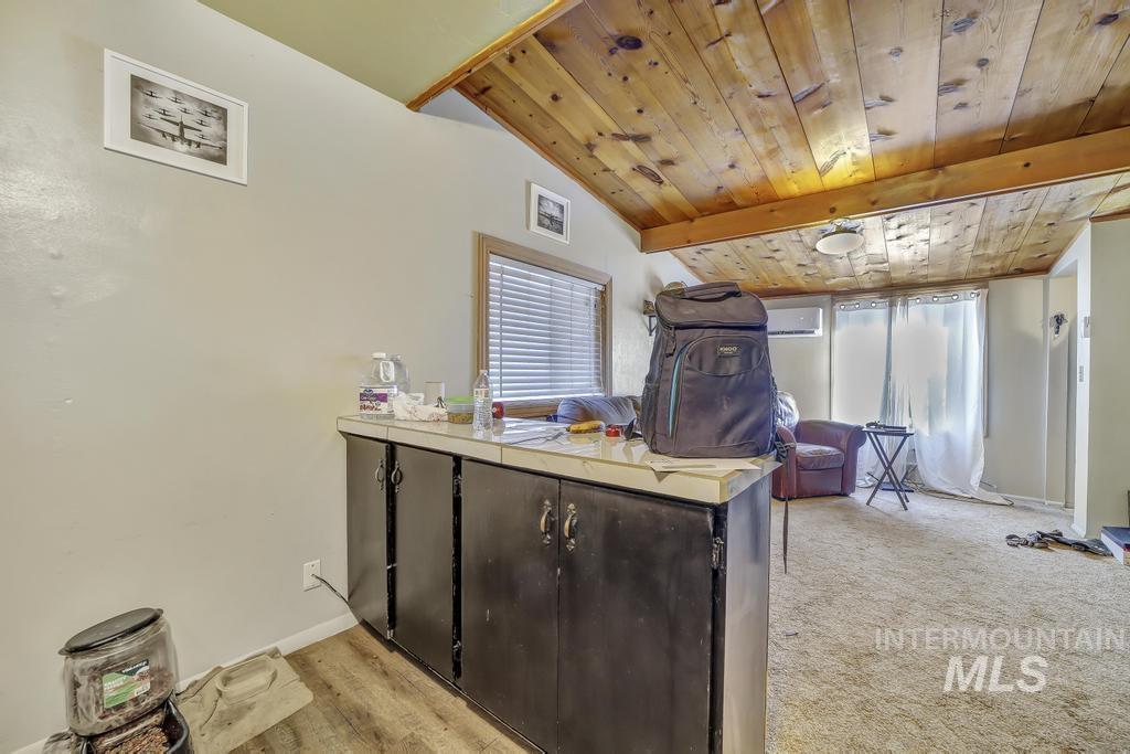 111 2nd Street Rupert, ID 83350 - Photo 25 of 45 Wood-finish flooring paired with a wood-paneled ceiling