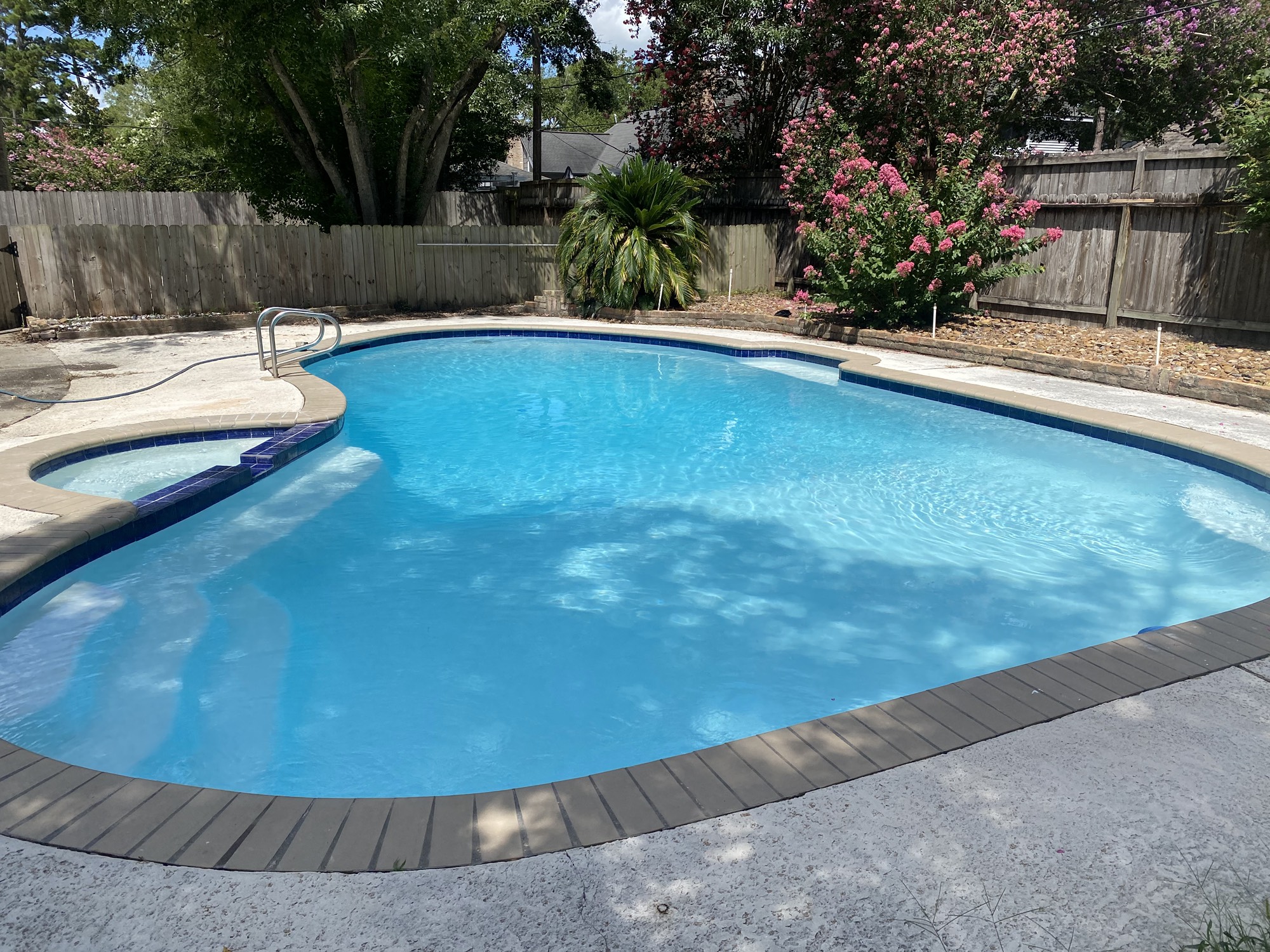 Looks like new. Recently replastered pool and hot tub and new coping.