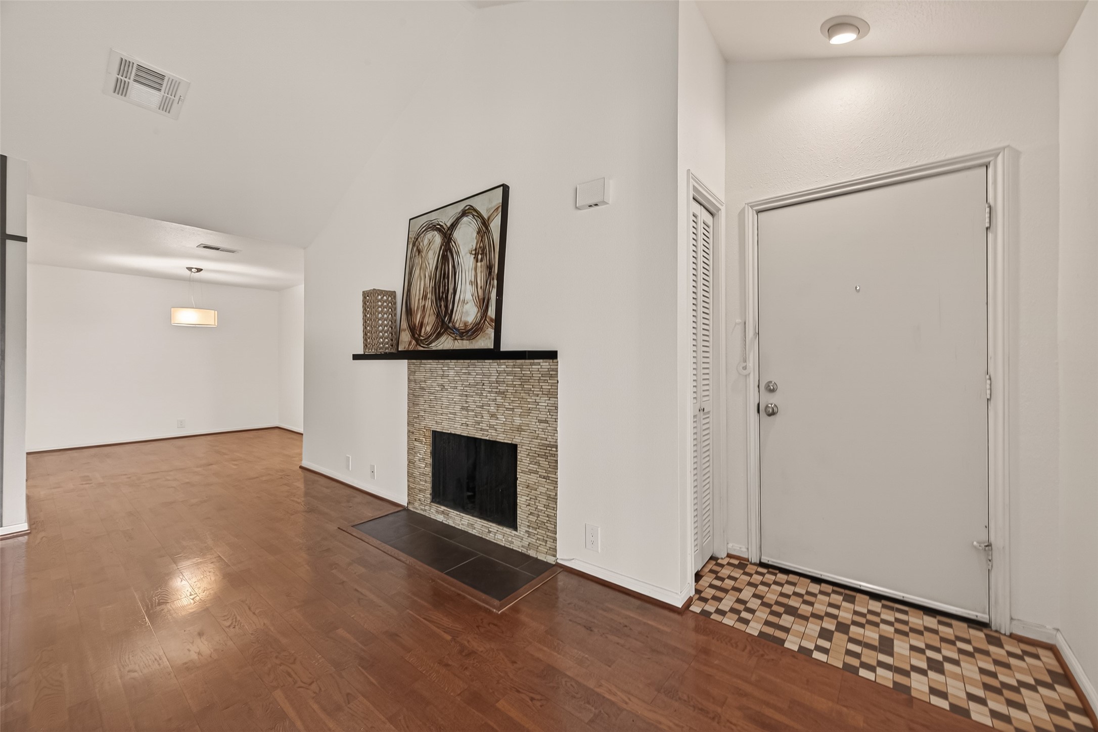 2829 Timmons Lane, Unit 144 Houston, TX 77027 - Photo 2 of 41 Welcoming and conveying warmth, the living room offers an inviting space for evening movies or holiday gatherings. Tune into your favorite streaming show, while admiring the cozy fireplace.