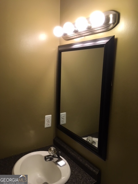 602 Freeman Drive Athens, GA 30601 - Photo 4 of 6 a bathroom with a toilet and a sink
