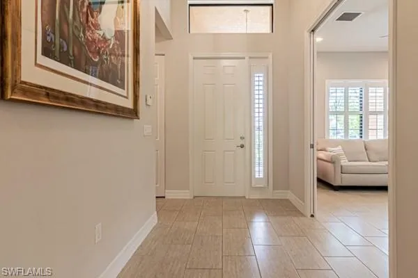 a view of a livingroom with furniture and windows