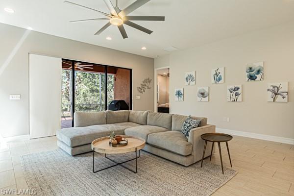 3471 Pacific Drive Naples, FL 34119 - Photo 6 of 29 a living room with furniture and a large window