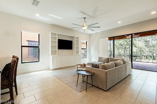 3471 Pacific Drive Naples, FL 34119 - Photo 7 of 29 a living room with furniture and a flat screen tv