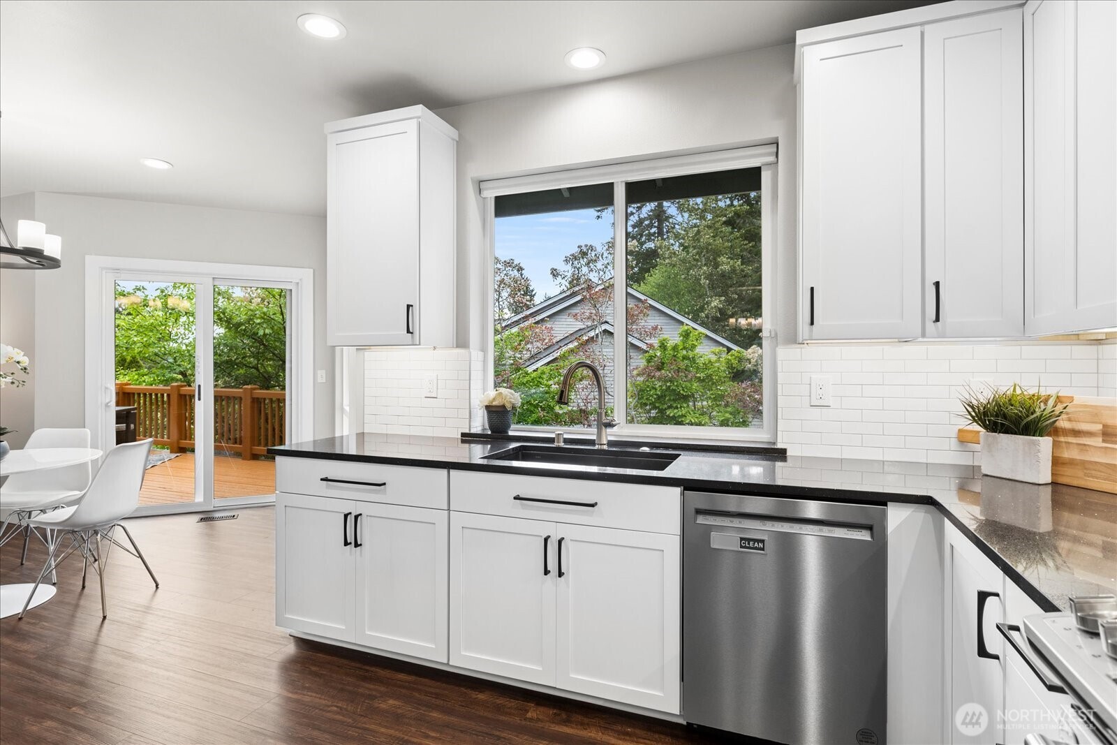 20012 27th Drive Southeast Bothell, WA 98012 - Photo 11 of 39 a kitchen with stainless steel appliances white cabinets a sink and a large window