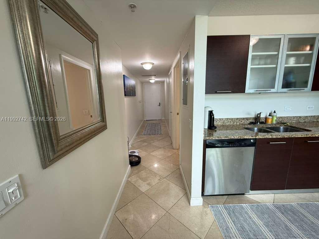41 Southeast 5th Street, Unit 1505 Miami, FL 33131 - Photo 5 of 16 a bathroom with a sink and a mirror