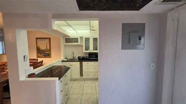 a kitchen with a sink and cabinets