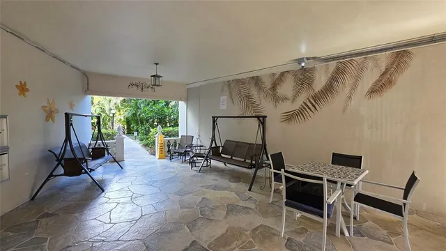 a view of a garden with large trees