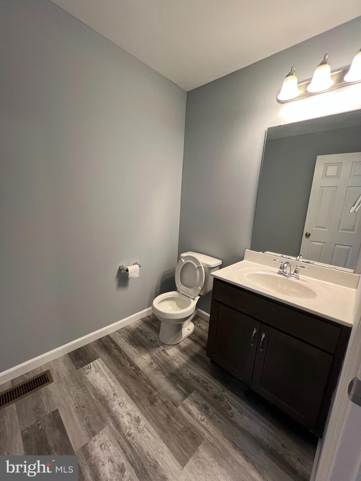 2317 Bartlett Road Harrisburg, PA 17110 - Photo 17 of 59 a bathroom with a sink mirror and toilet