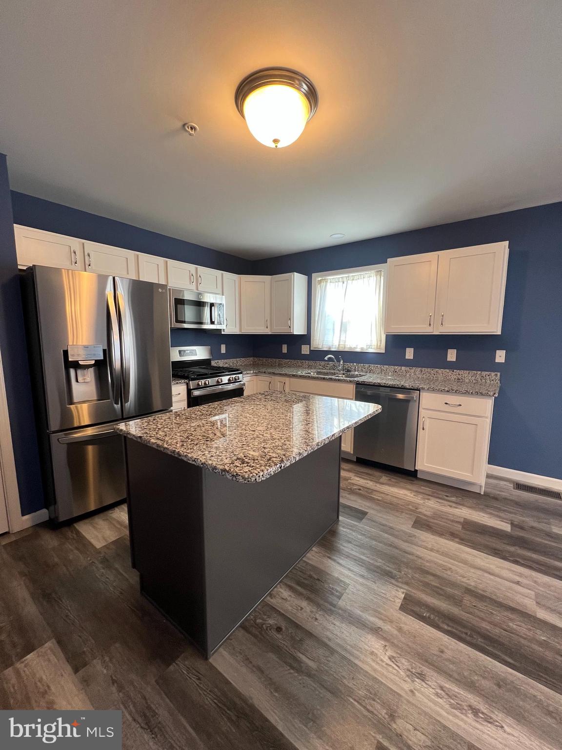 2317 Bartlett Road Harrisburg, PA 17110 - Photo 20 of 59 a kitchen with stainless steel appliances granite countertop a sink counter space cabinets and a window