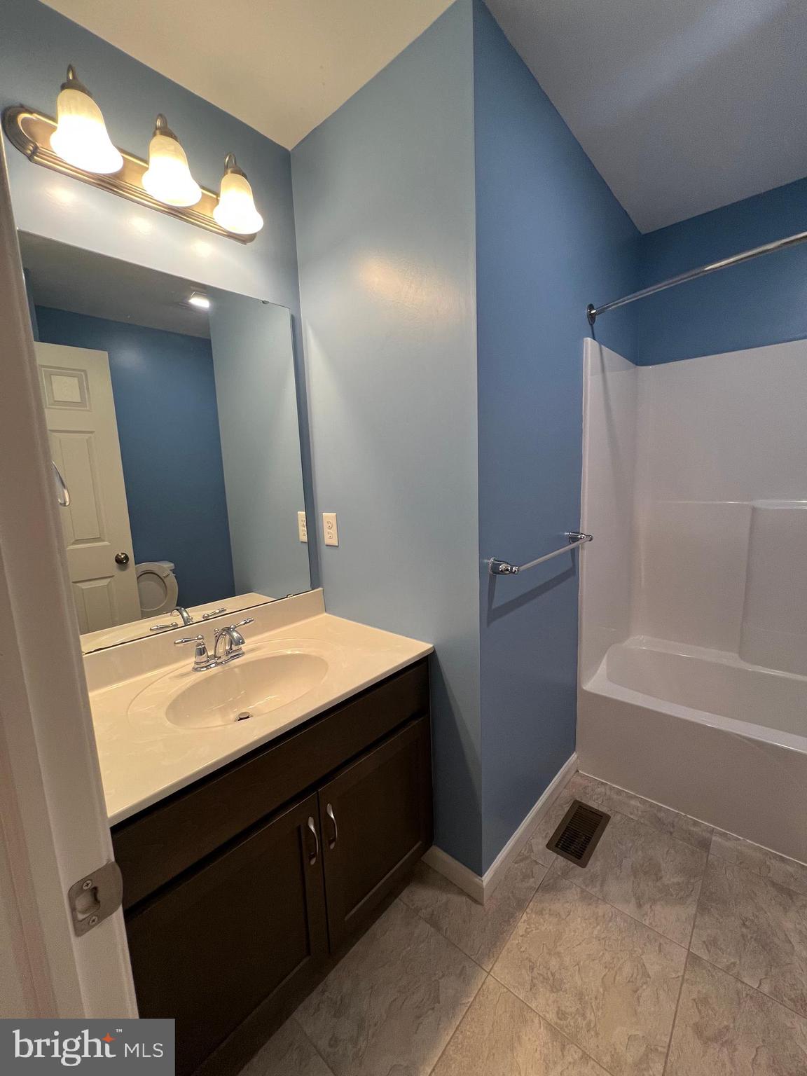 2317 Bartlett Road Harrisburg, PA 17110 - Photo 43 of 59 a bathroom with a tub sink vanity granite and a mirror