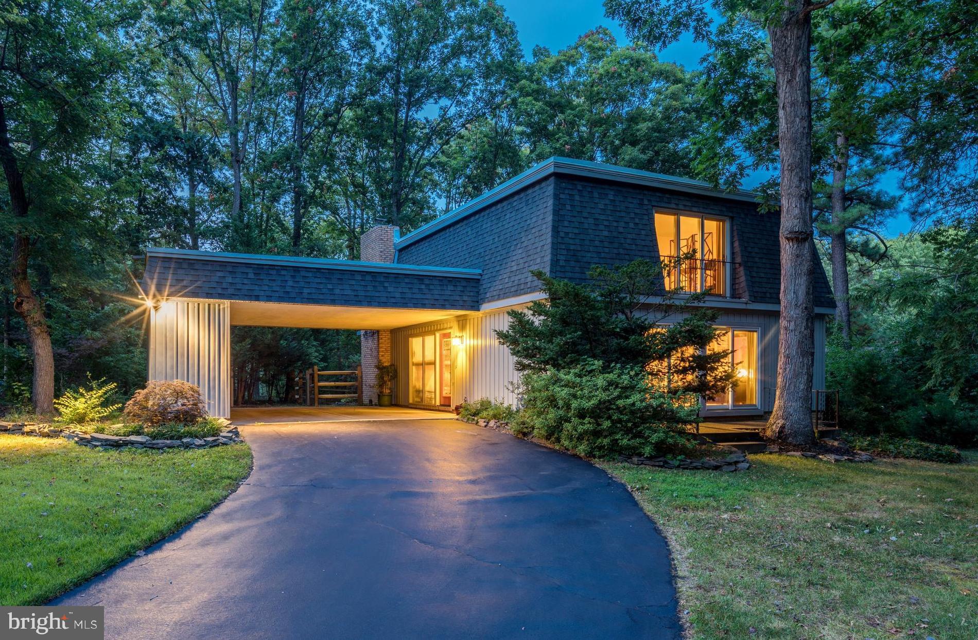 Long driveway with welcoming lights