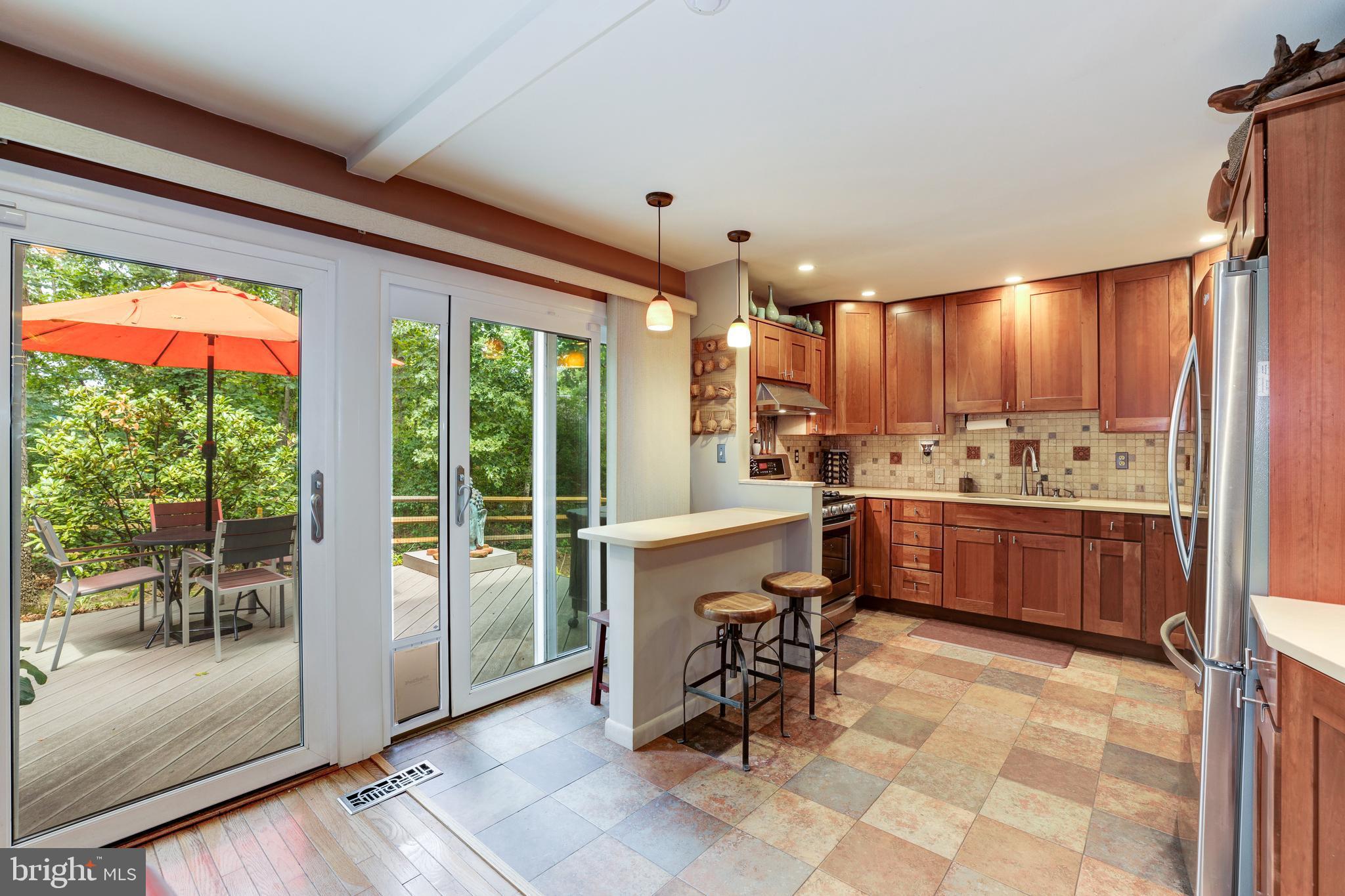 1407 Aldenham Lane Reston, VA 20190 - Photo 19 of 56 kitchen with access to back yard