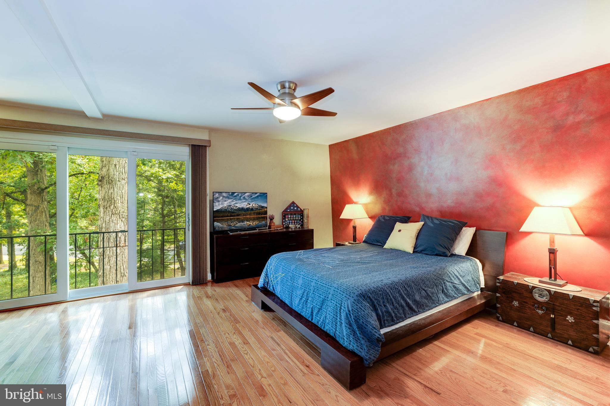 1407 Aldenham Lane Reston, VA 20190 - Photo 29 of 56 Master bedroom suite with a large sliding glass