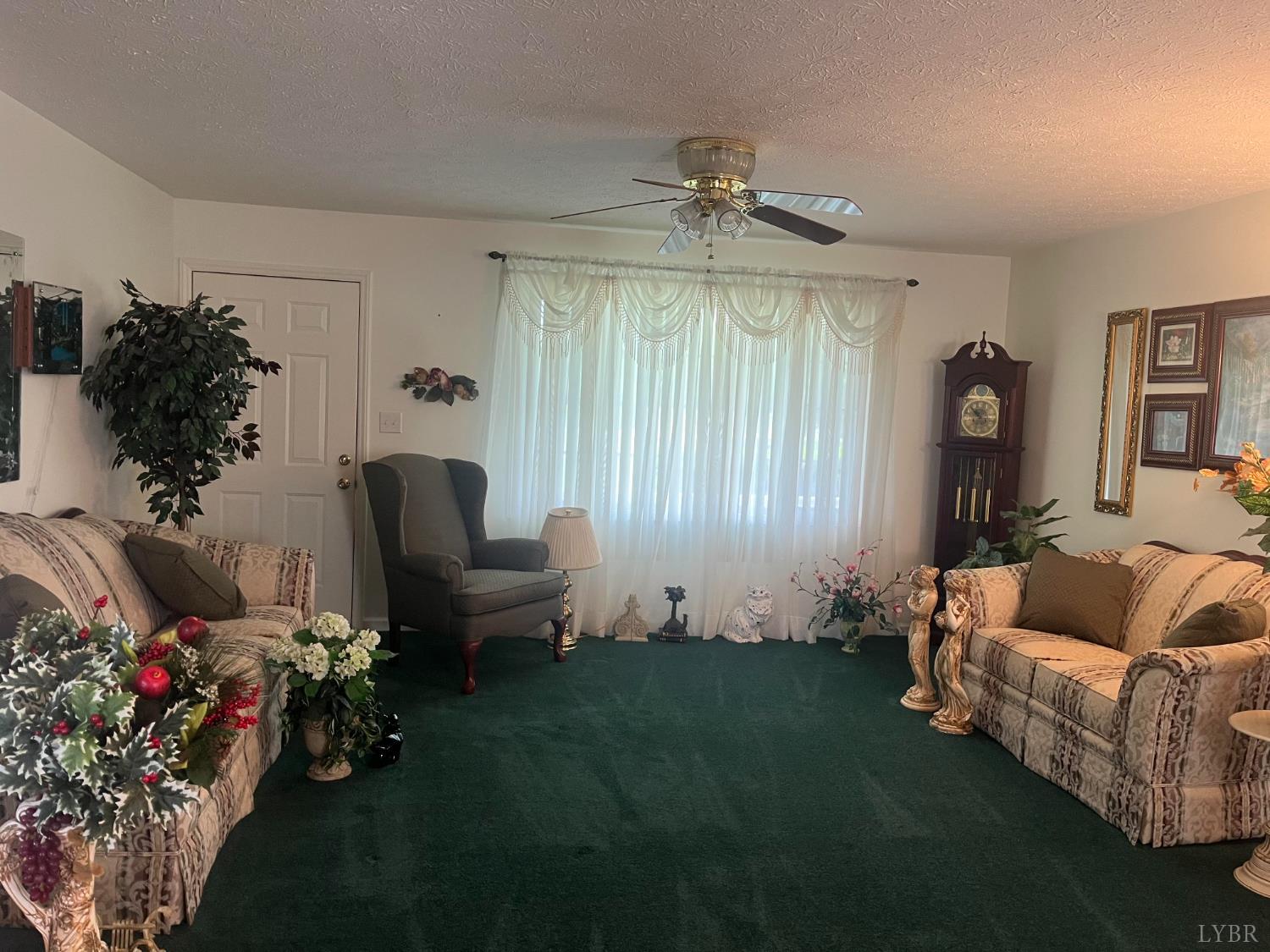 2135 Spring Garden Road Chatham, VA 24531 - Photo 5 of 18 a living room with furniture and flowers