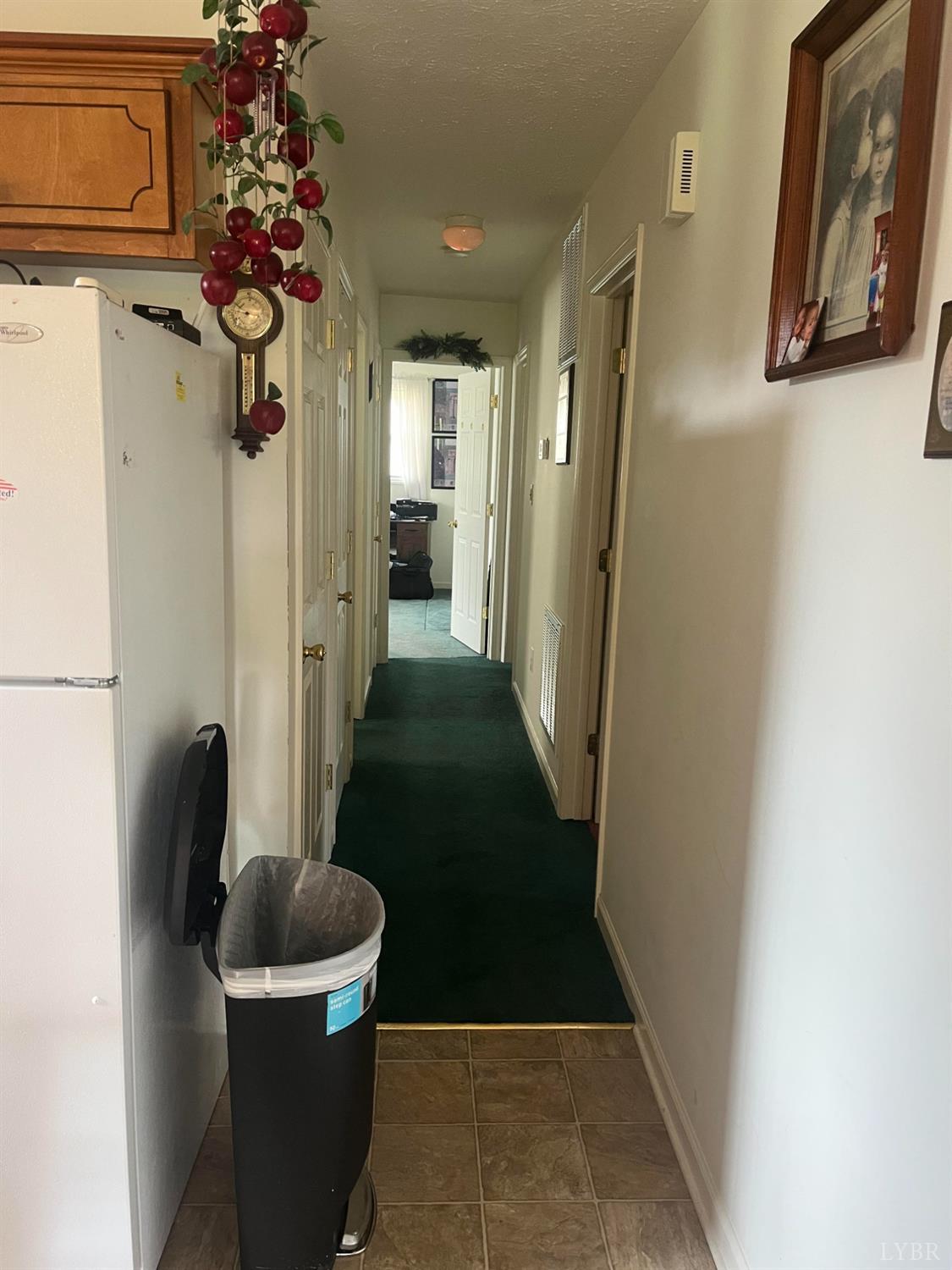 2135 Spring Garden Road Chatham, VA 24531 - Photo 6 of 18 a view of a hallway with paintings on the wall