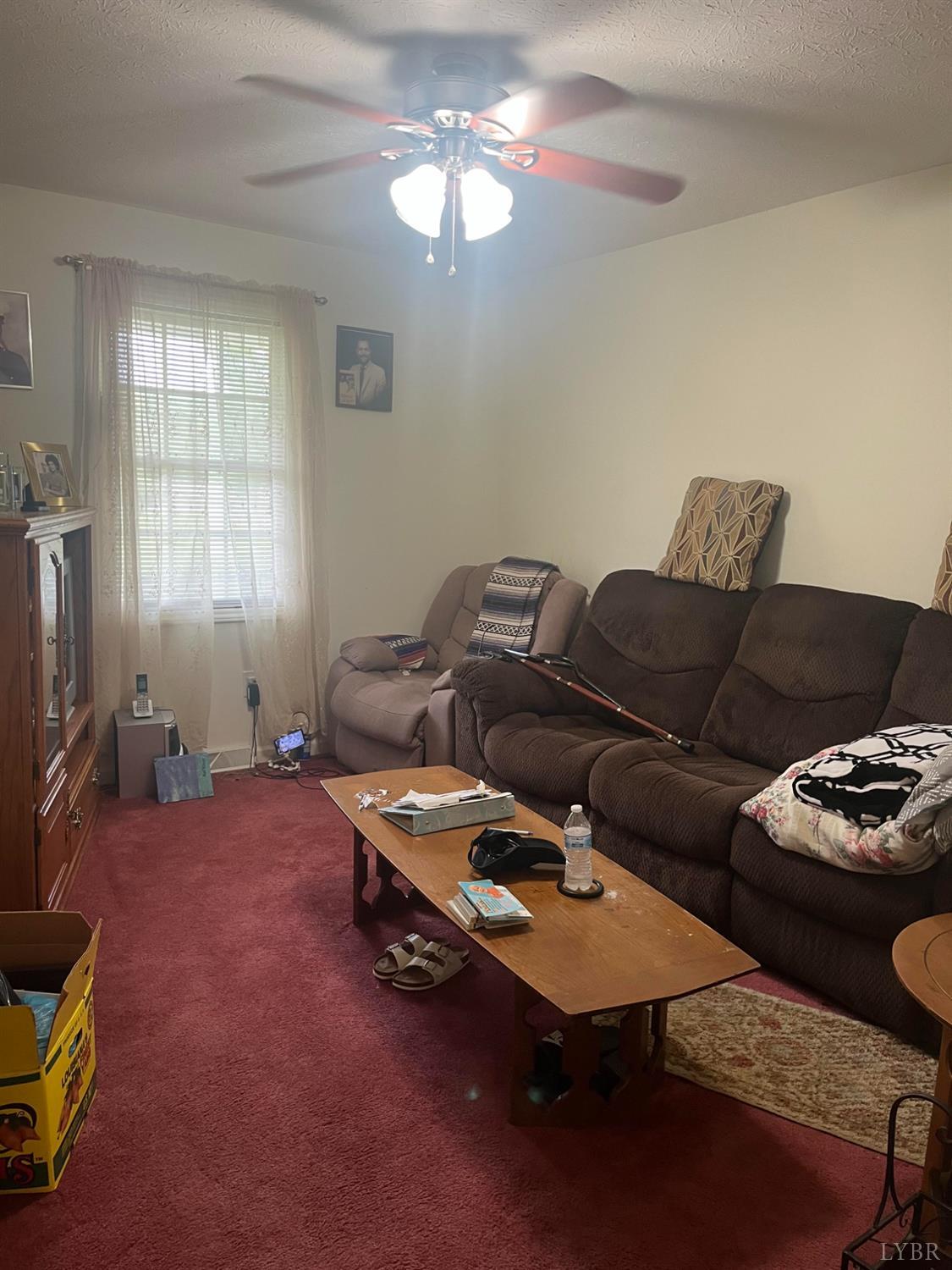 2135 Spring Garden Road Chatham, VA 24531 - Photo 7 of 18 a living room with furniture a air conditioner vent and a window