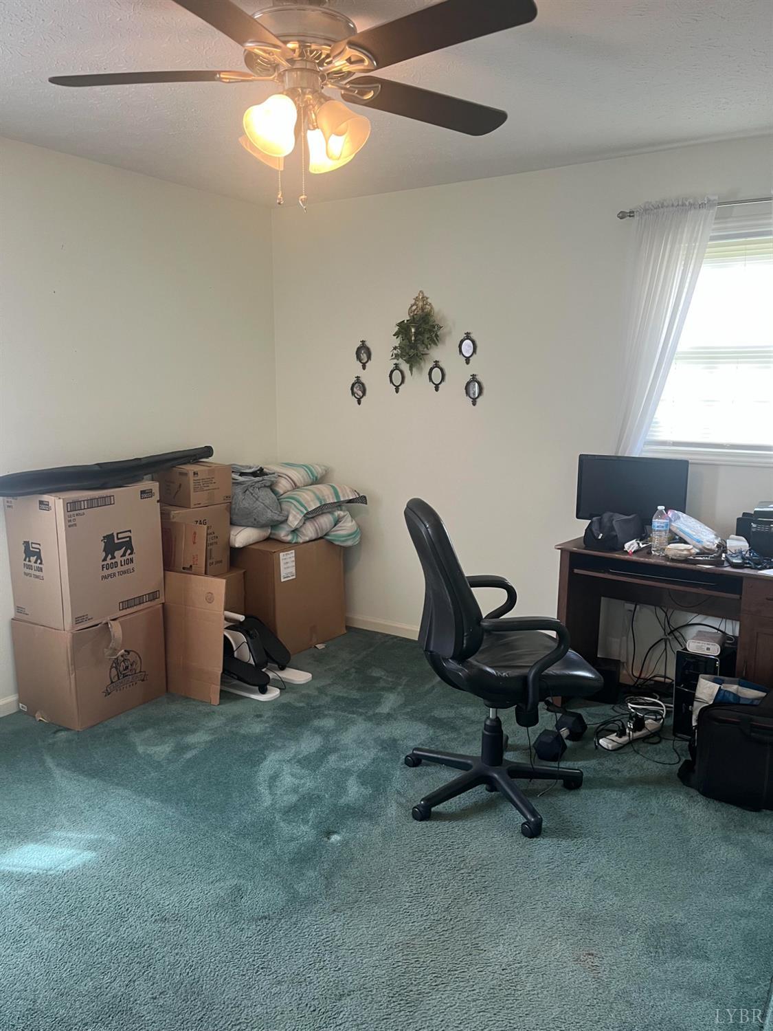 2135 Spring Garden Road Chatham, VA 24531 - Photo 8 of 18 a room with furniture and a window