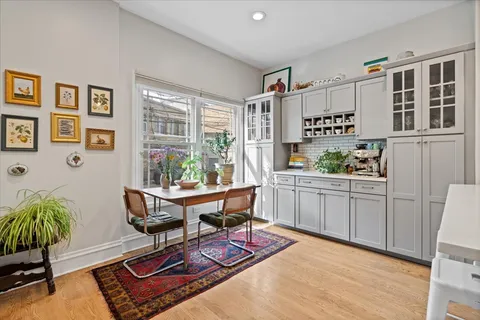 a workspace with furniture and a potted plant