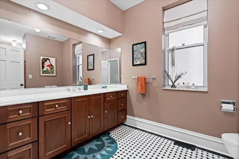 a bathroom with a sink a vanity and a mirror