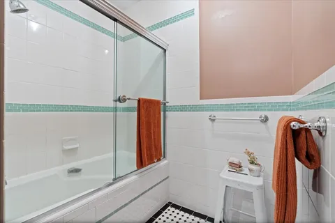 a bathroom with a shower and a tub