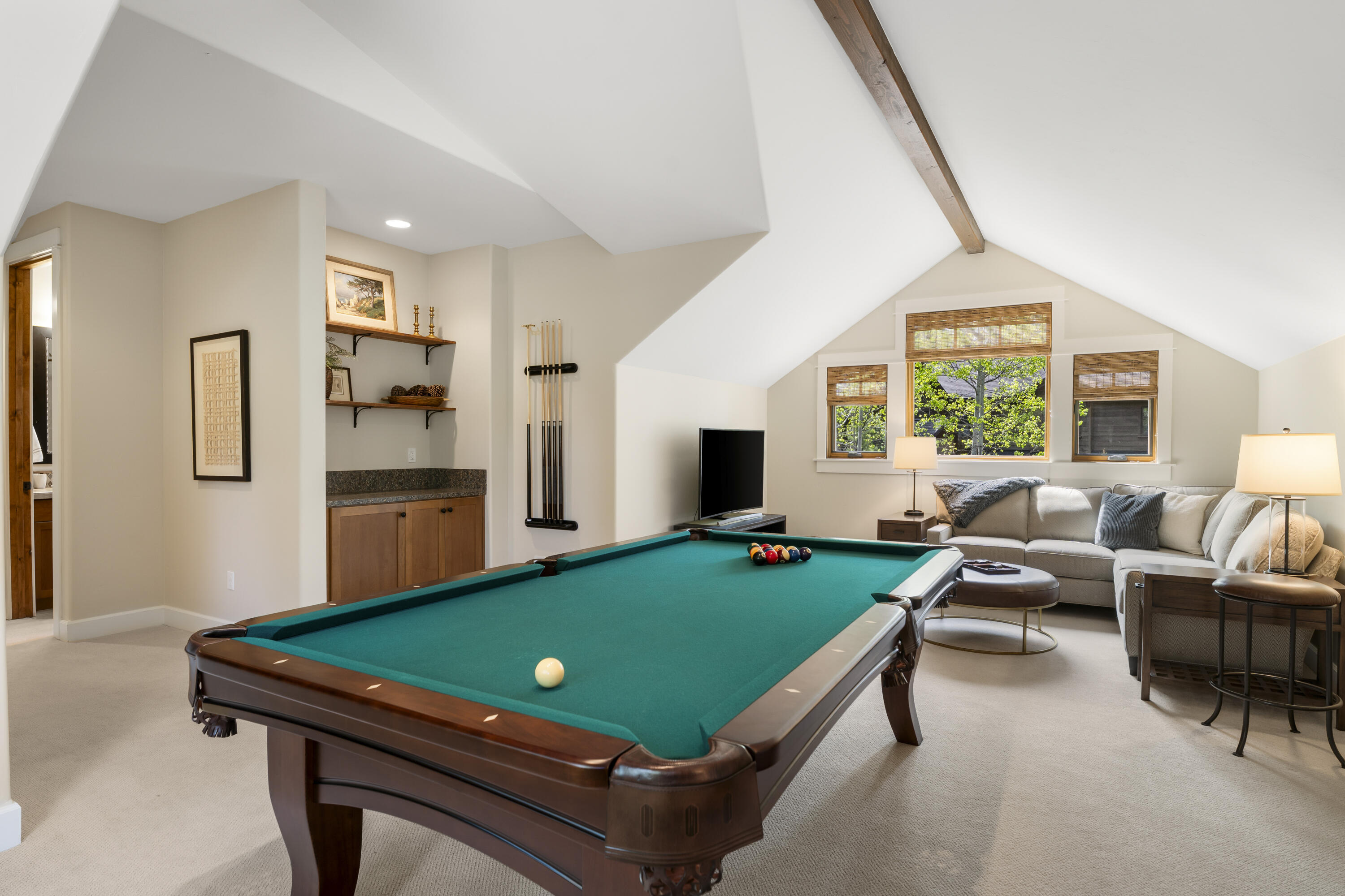 56155 Sable Rock Loop, Unit 277 Bend, OR 97707 - Photo 48 of 63 Vaulted ceilings, abundant natural light, and a full-size pool table create an inviting and versatile entertainment retreat.