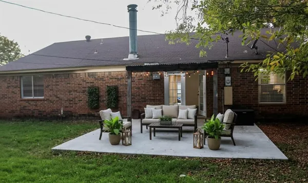 a view of yard with patio