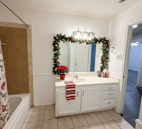 a kitchen that has a sink and a mirror in it