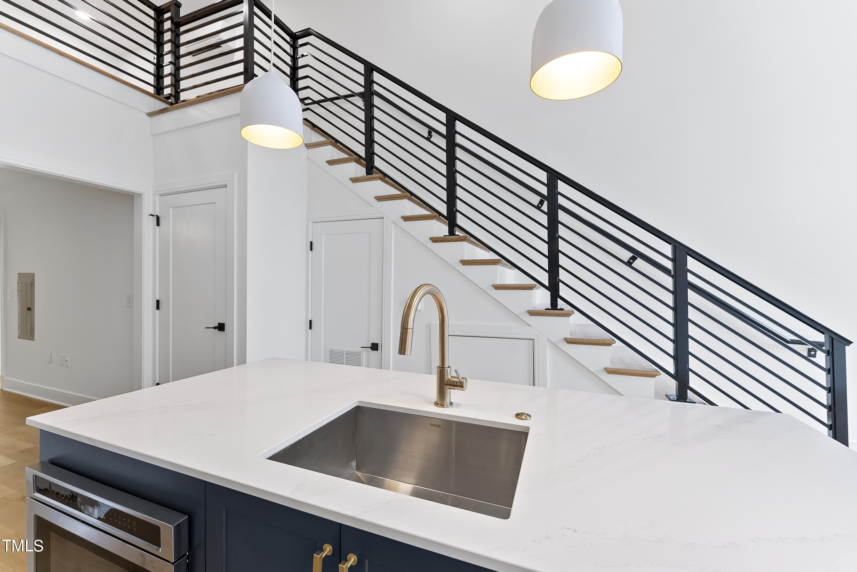 a kitchen with a sink and a stove