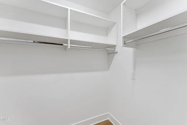 a view of an empty walk in closet