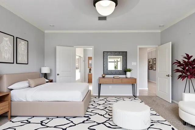 a bedroom with a bed and a couch