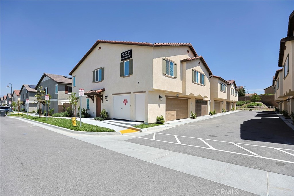 7486 Olive Grv Street Riverside, CA 92507 - Photo 47 of 57 a front view of a house with a yard