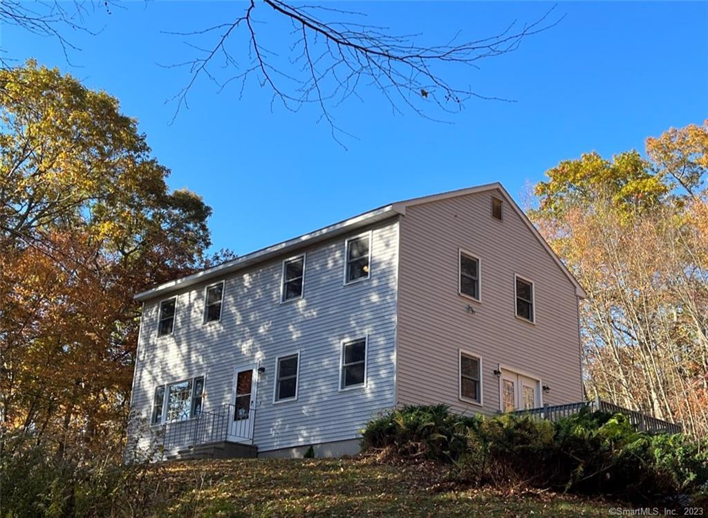 94 Sarah Pearl Road Hampton, CT 06247 - Photo 1 of 1 a front view of a house with plants