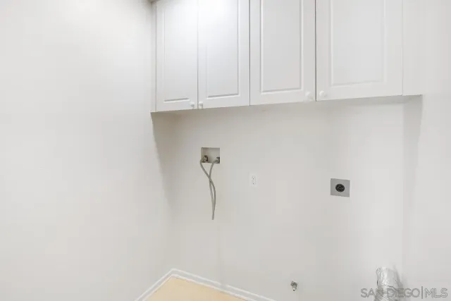 a view of a livingroom with a ceiling fan and window